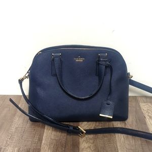 Navy Kate spade purse. New and never used.  Comes with a crossbody strap. 11"